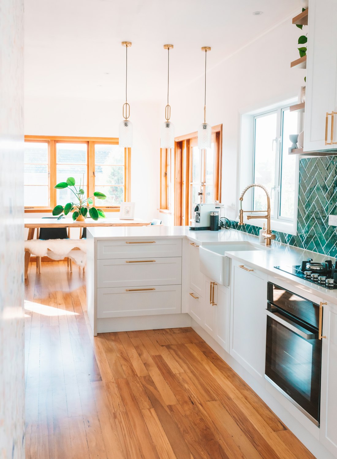 A bright kitchen with wood flooring