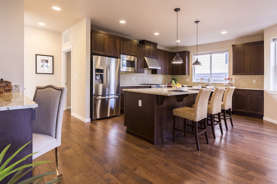 A kitchen with new wood flooring
