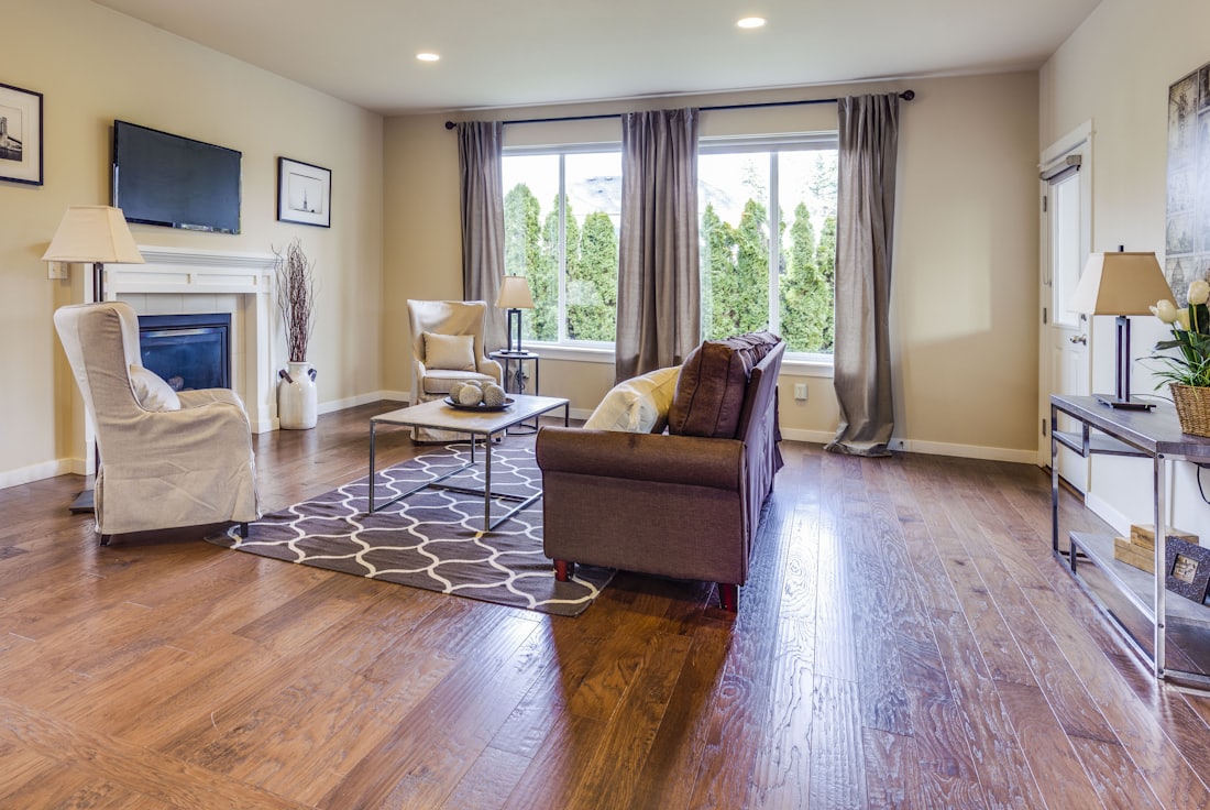 A living room with new hardwood flooring